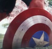 Captain America's shield smashed half way into concrete next to the legs of Red Hulk.